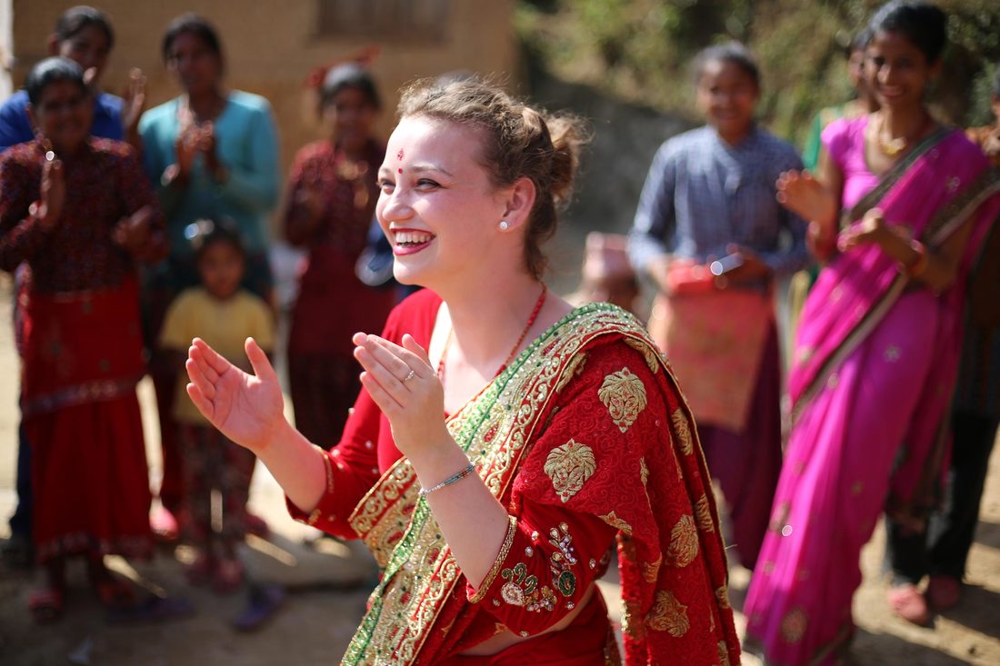 Female student dancing in local costume, Nepal